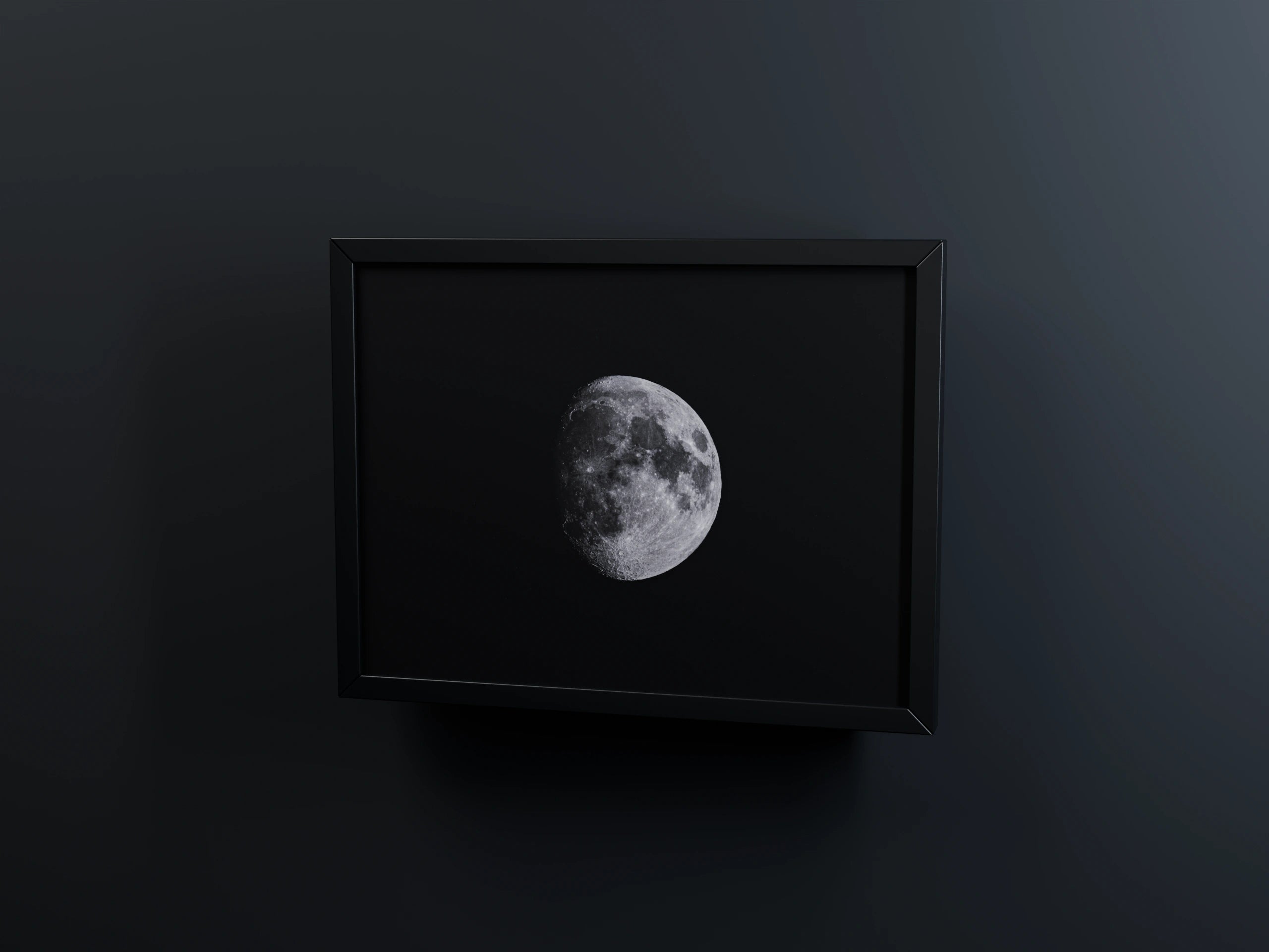 Moon photograph in a black frame with a soft shadow on a dark background – 3D view